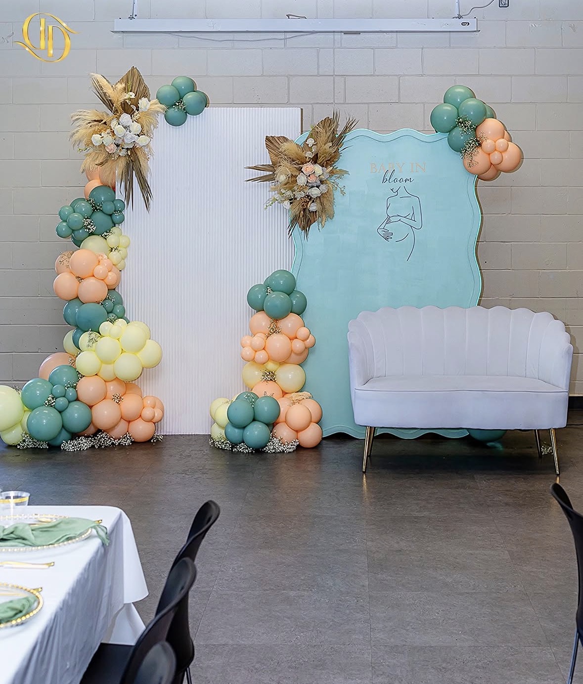 Teal and peach balloon arch baby shower