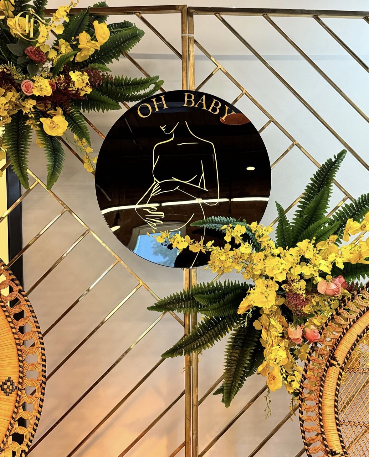 Oh Baby gold and tropical floral detail